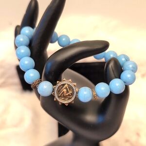 💵2/$10Bundle and Save💵 Blue Beaded Bracelet With Gold Toned Symbol Focus